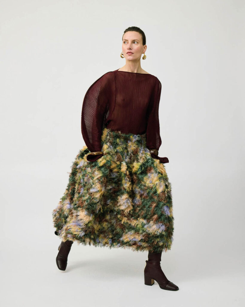 Ladies Drive No. 75. Julia Heuer fashion with signature hand-pleated textiles